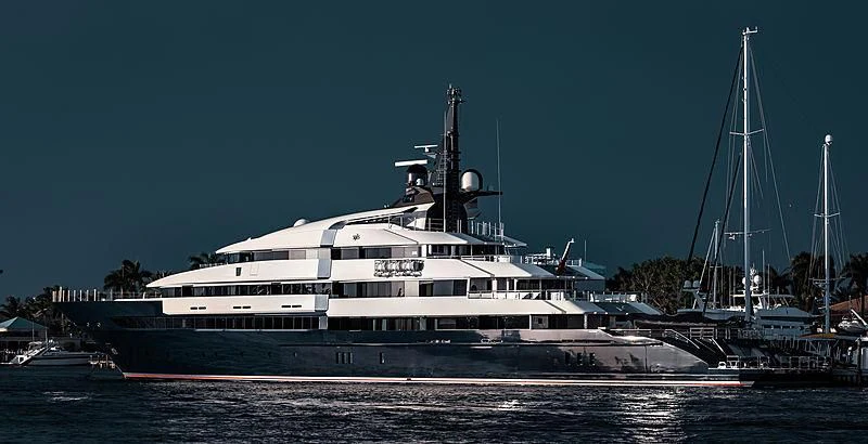 a large white boat in the water aboard MAN OF STEEL Yacht for Charter