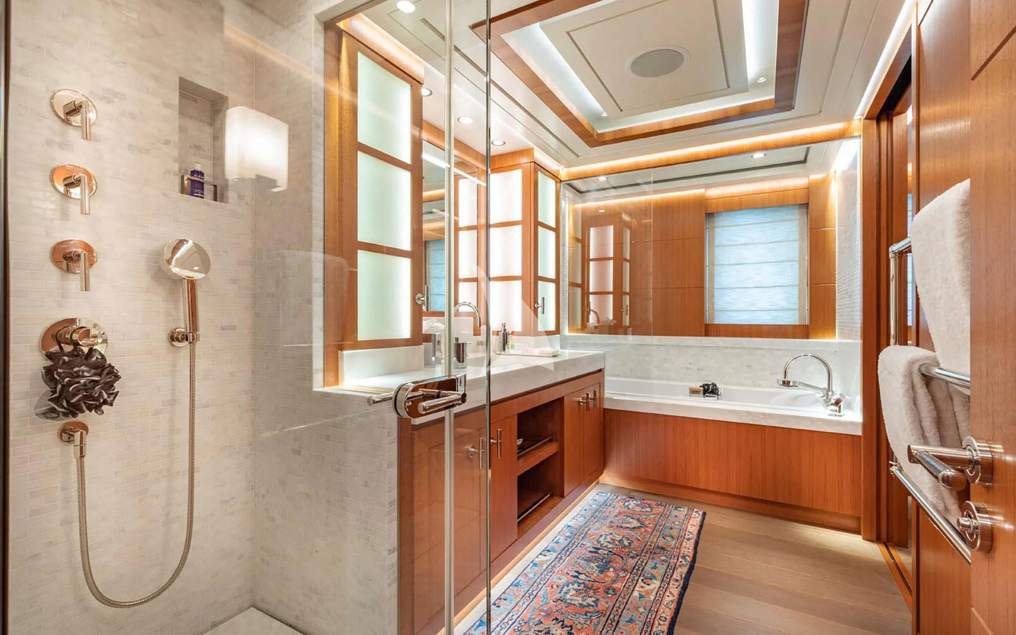 a bathroom with a sink and a shower aboard MAN OF STEEL Yacht for Charter