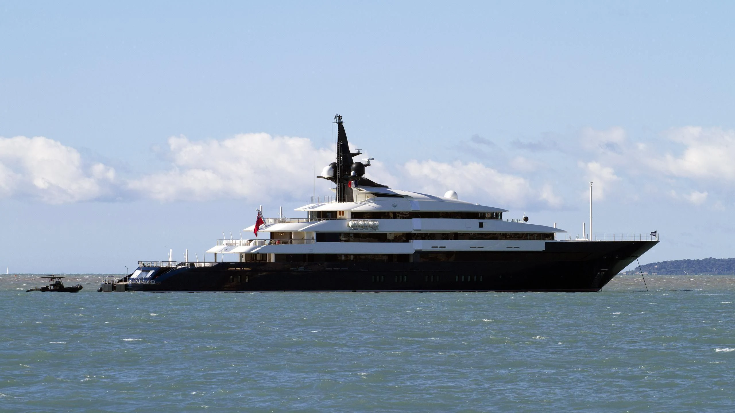 a large ship in the water aboard MAN OF STEEL Yacht for Charter