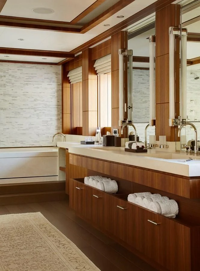 a bathroom with a large mirror aboard MAN OF STEEL Yacht for Charter