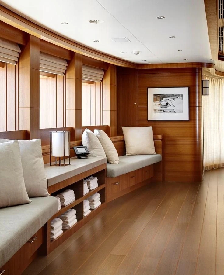 a living room with a couch and a coffee table aboard MAN OF STEEL Yacht for Charter