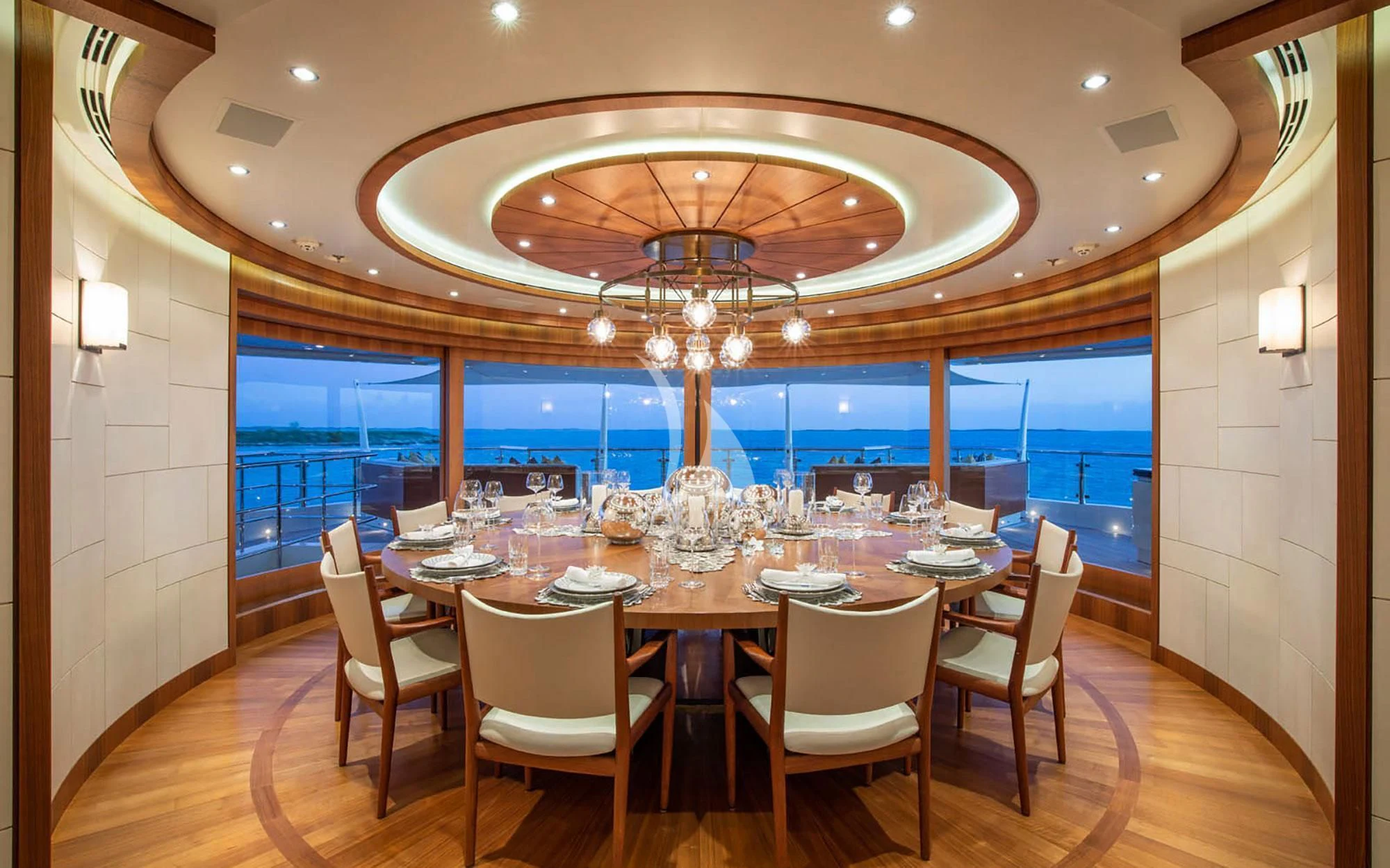 a dining room with a large table and chairs aboard MAN OF STEEL Yacht for Charter