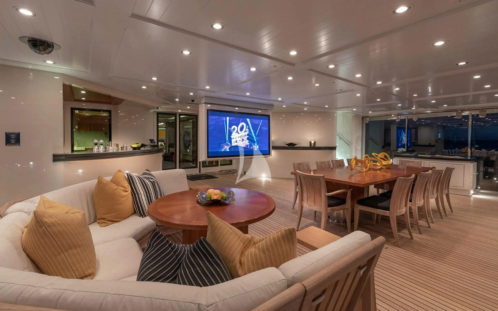 a living room with a large screen aboard MAN OF STEEL Yacht for Charter