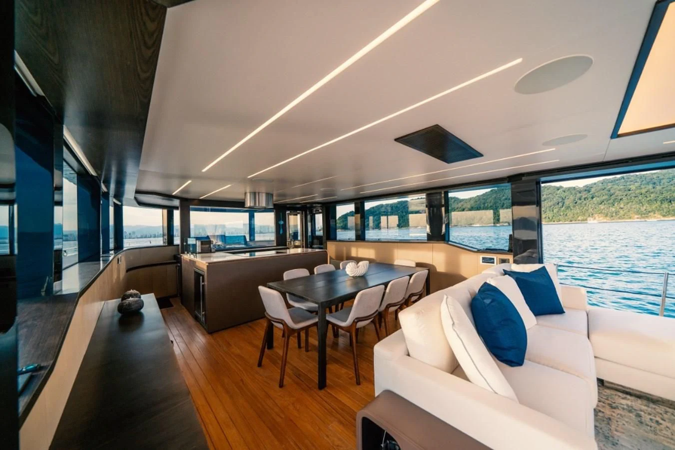 a living room with a large window aboard OKEAN 80/01 Yacht for Sale