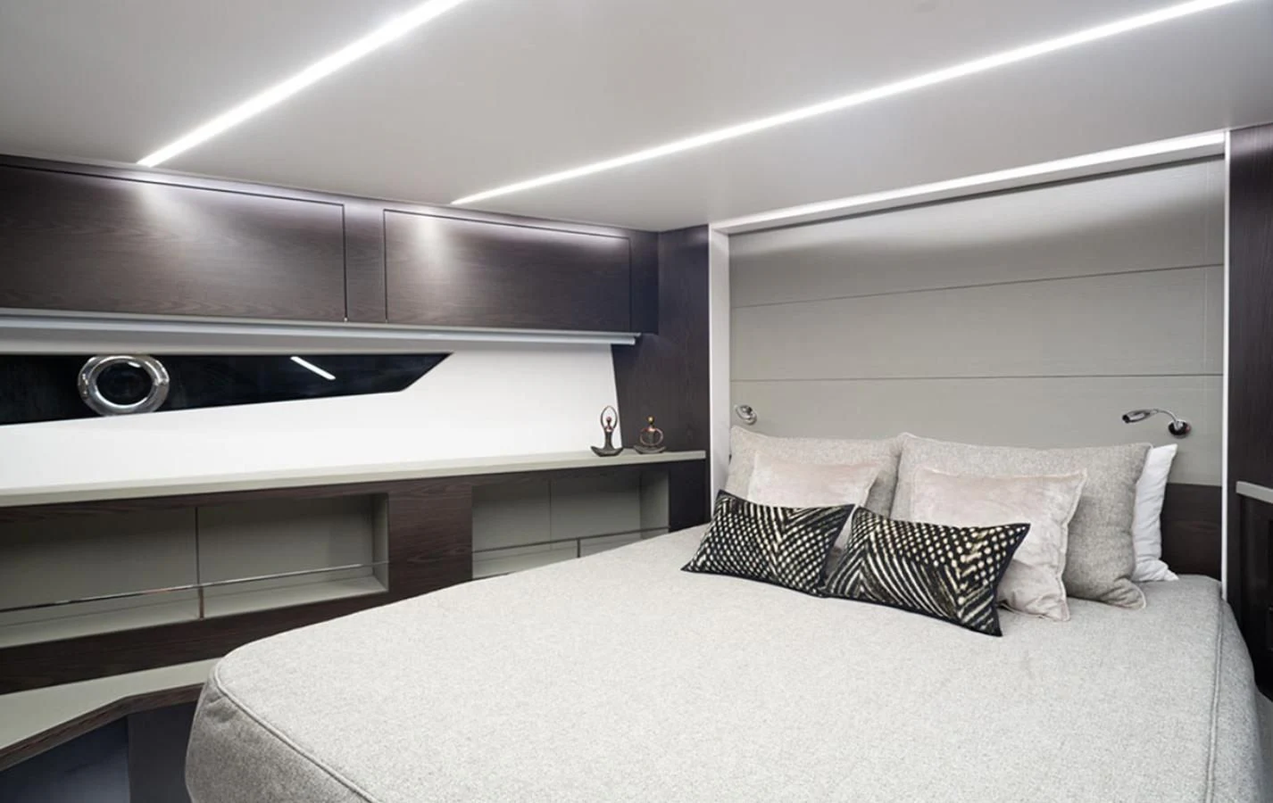 a bed with a white bed spread aboard OKEAN 80/01 Yacht for Sale