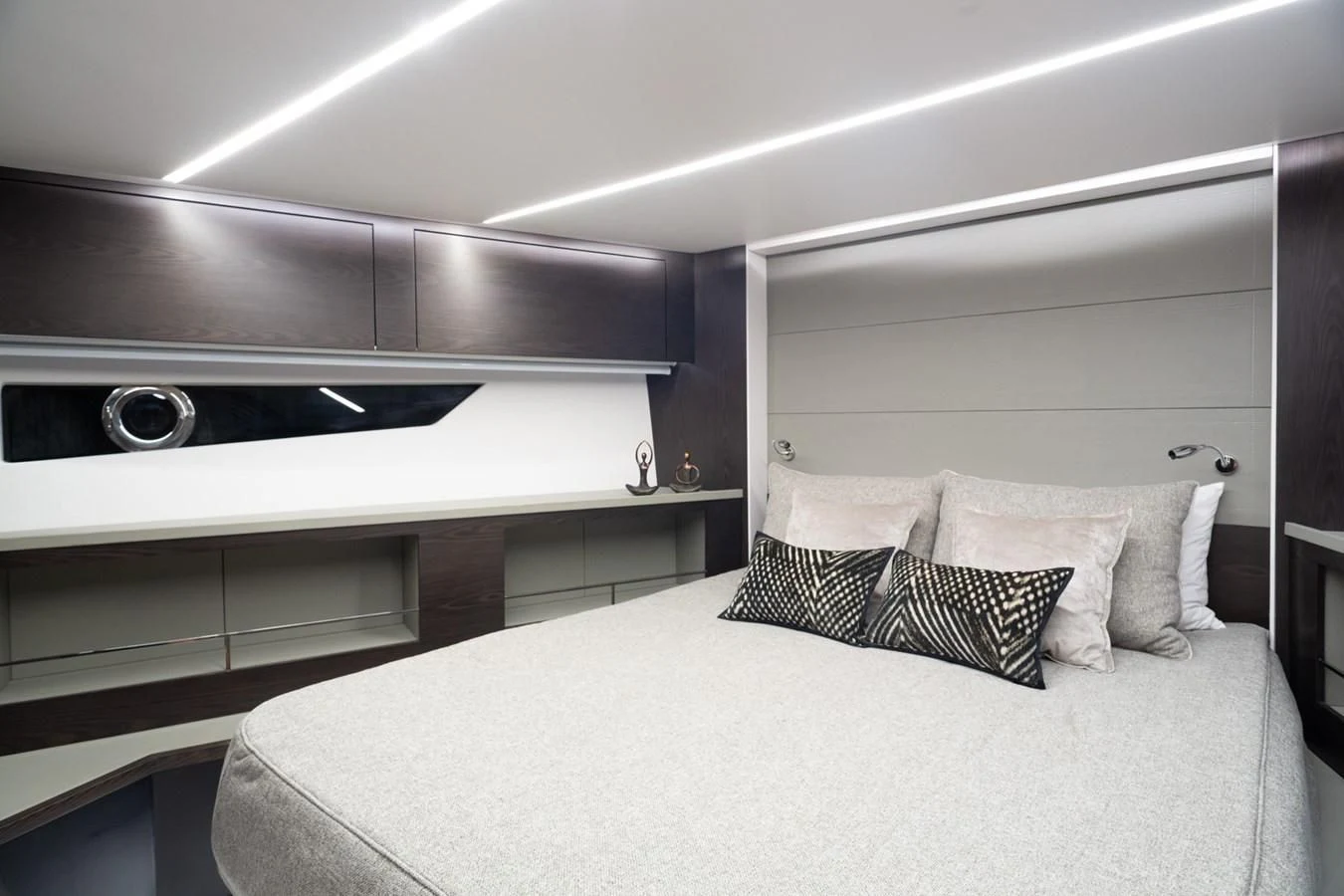a bed with a white bed spread aboard OKEAN 80/01 Yacht for Sale