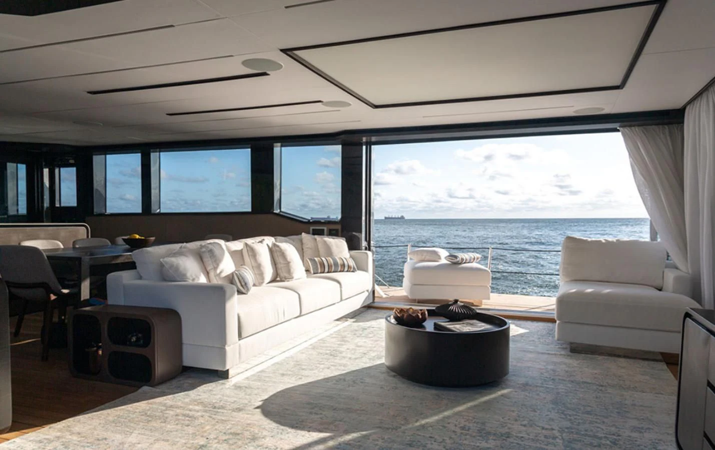 a living room with a large window aboard OKEAN 80/01 Yacht for Sale