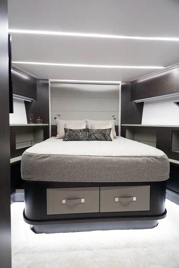 a bed with a white bed aboard OKEAN 80/01 Yacht for Sale