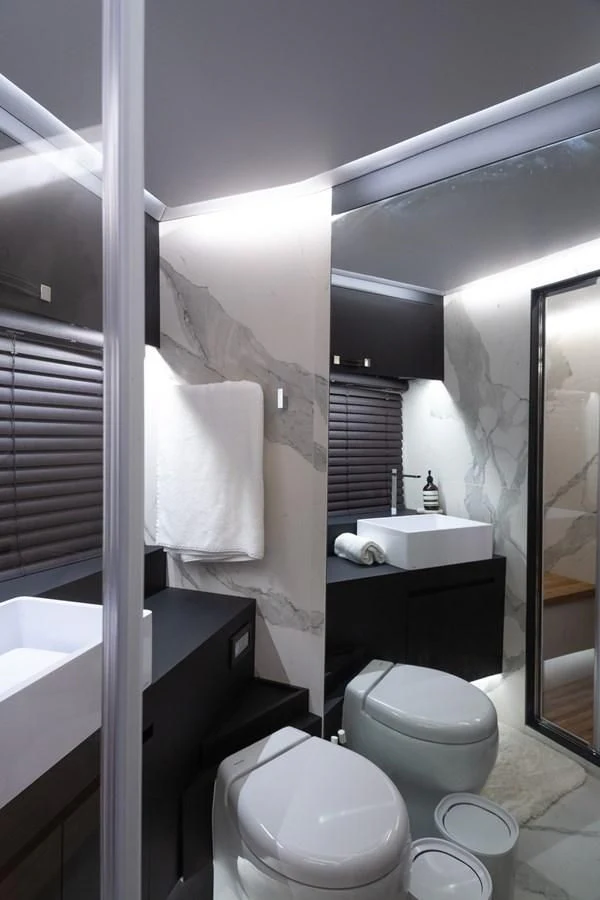 a bathroom with a toilet and a sink aboard OKEAN 80/01 Yacht for Sale
