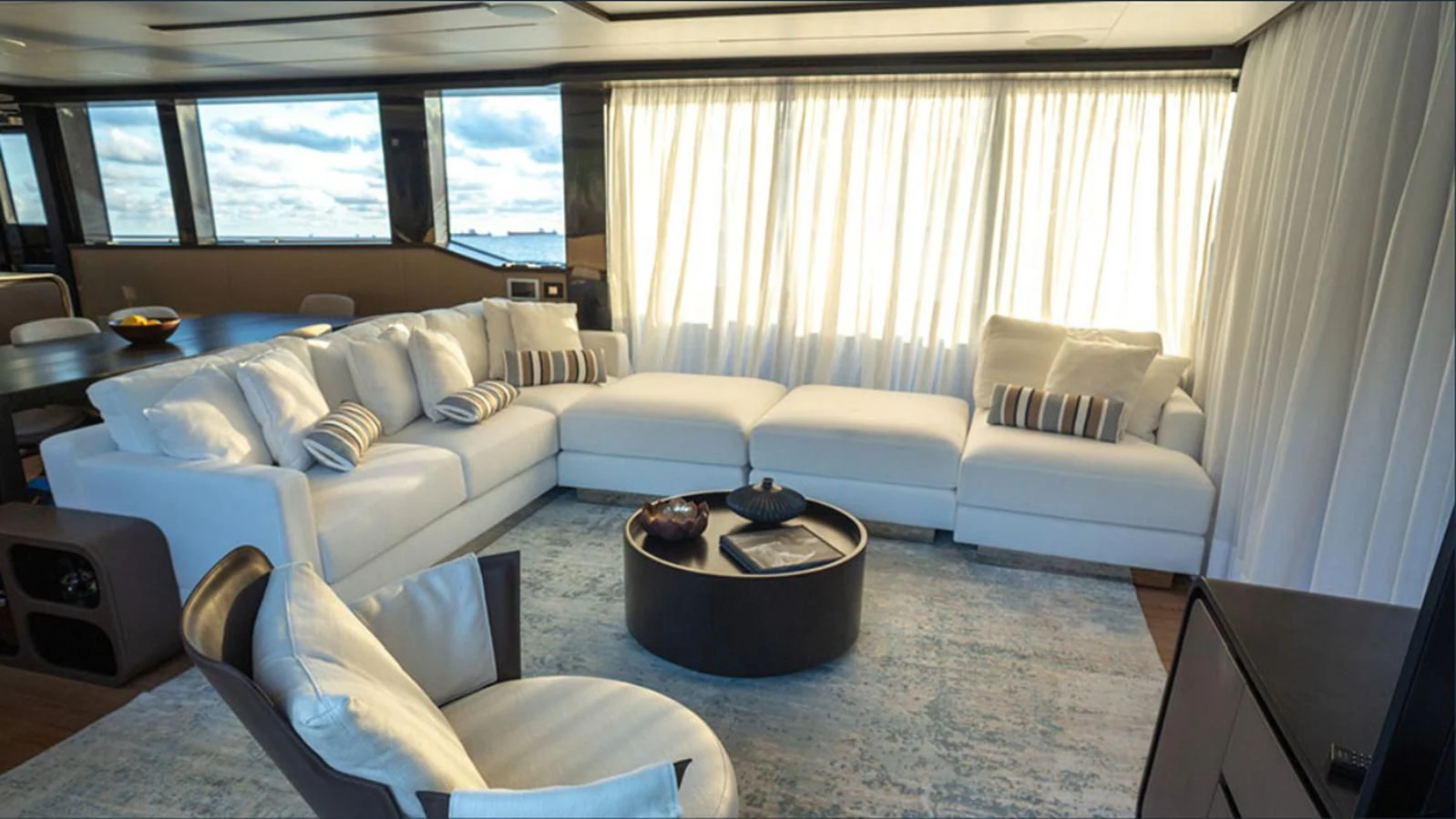 a living room with a couch and a table aboard OKEAN 80/01 Yacht for Sale