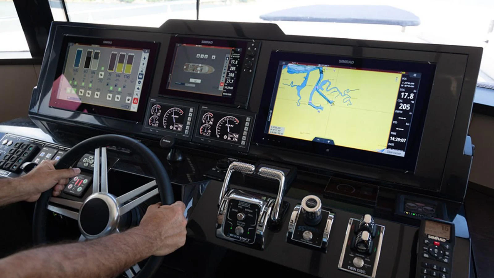 a person operating a computer aboard OKEAN 80/01 Yacht for Sale