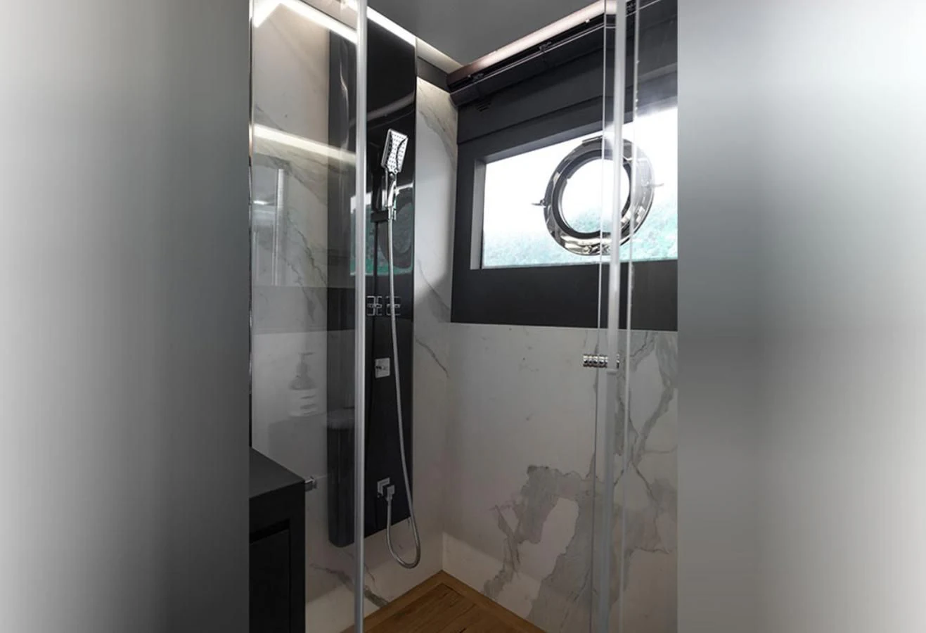 a room with a mirror and a window aboard OKEAN 80/01 Yacht for Sale