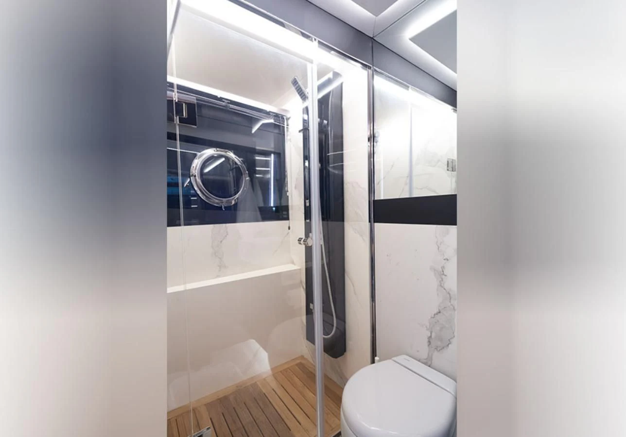 a bathroom with a glass shower aboard OKEAN 80/01 Yacht for Sale