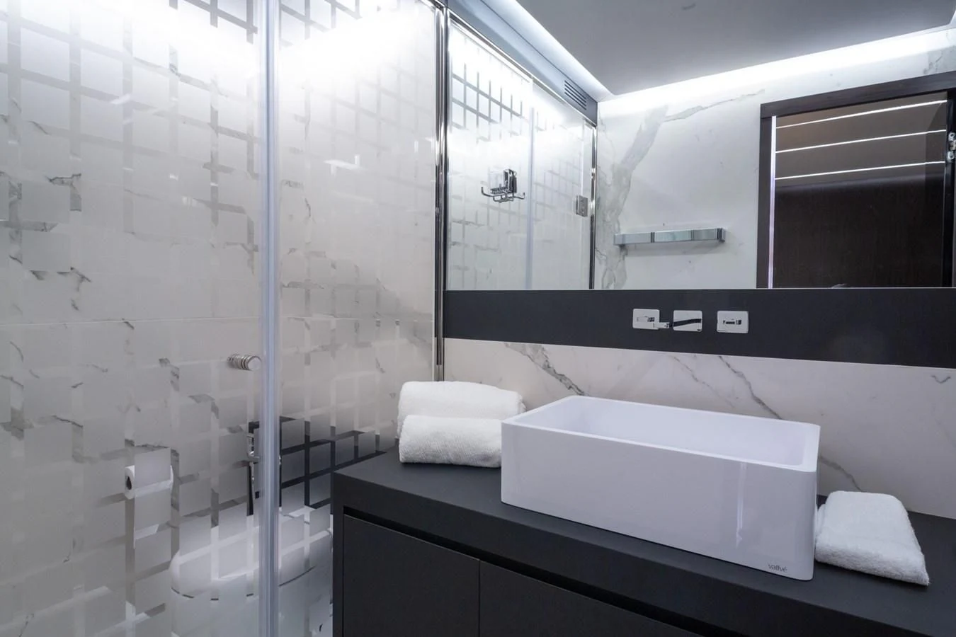 a bathroom with a glass shower aboard OKEAN 80/01 Yacht for Sale