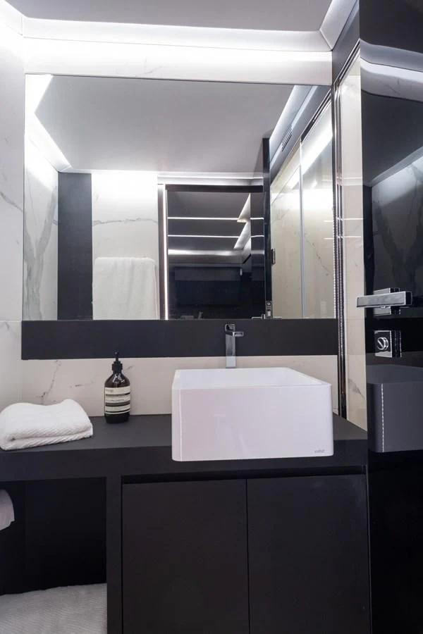a bathroom with a sink and a mirror aboard OKEAN 80/01 Yacht for Sale