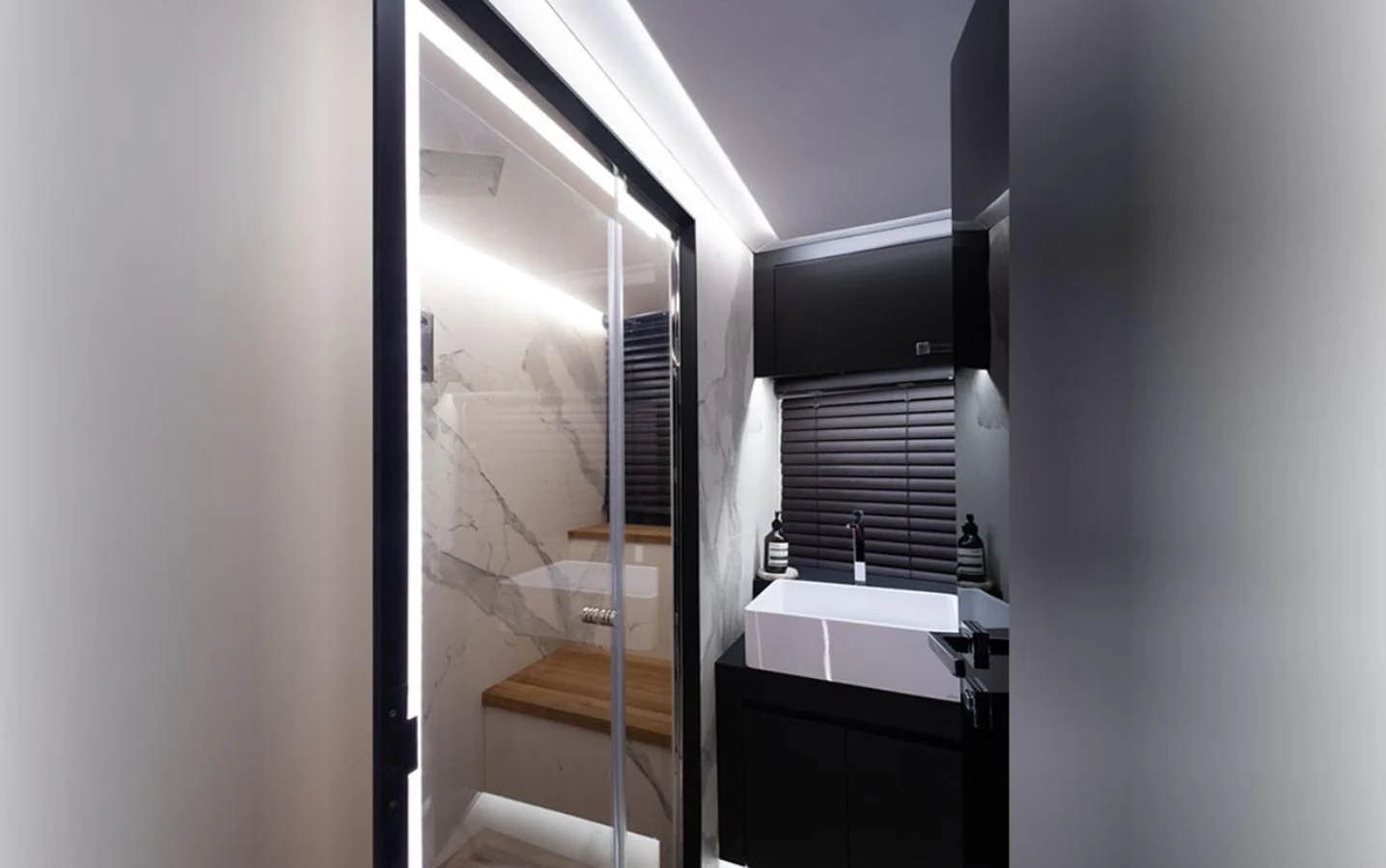a bathroom with a sink and a mirror aboard OKEAN 80/01 Yacht for Sale