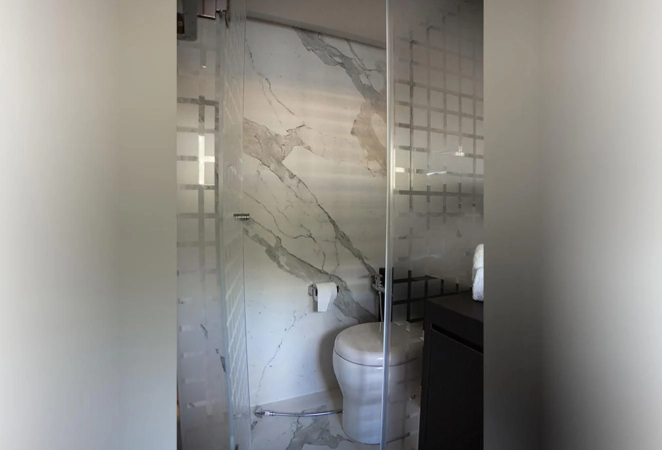 a bathroom with a toilet and a shower curtain aboard OKEAN 80/01 Yacht for Sale
