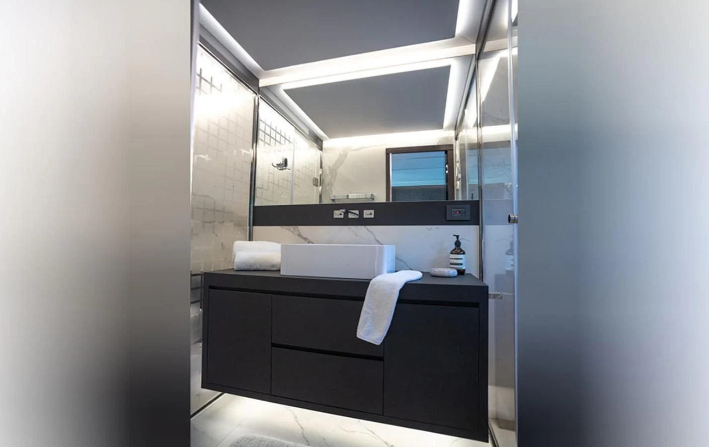 a bathroom with a countertop sink and cabinets aboard OKEAN 80/01 Yacht for Sale