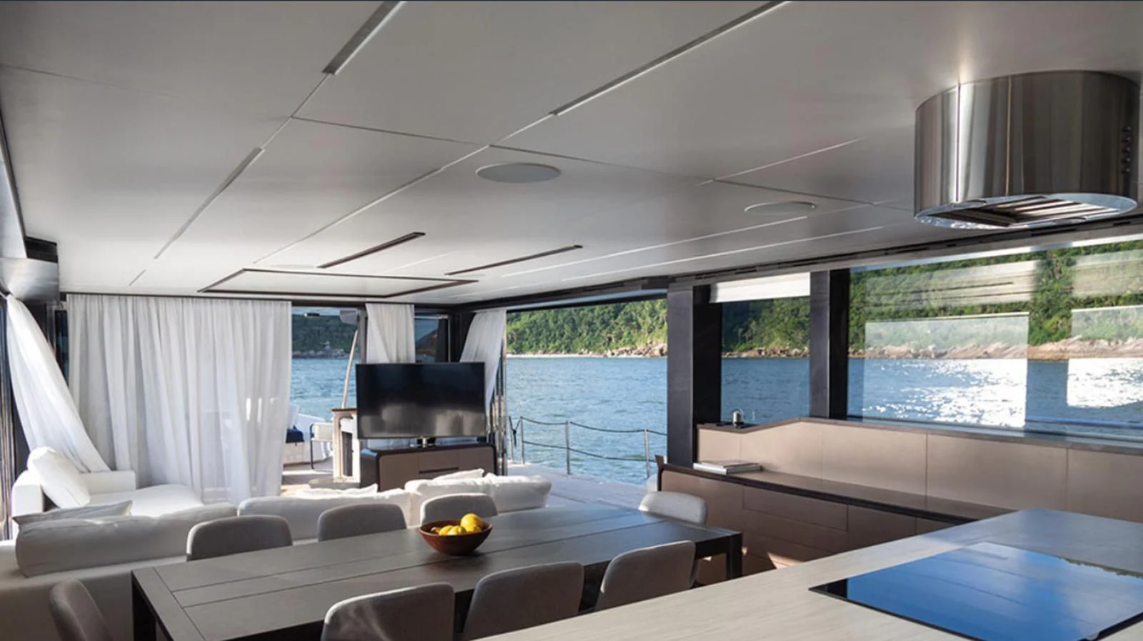 a room with a couch and a table and chairs aboard OKEAN 80/01 Yacht for Sale