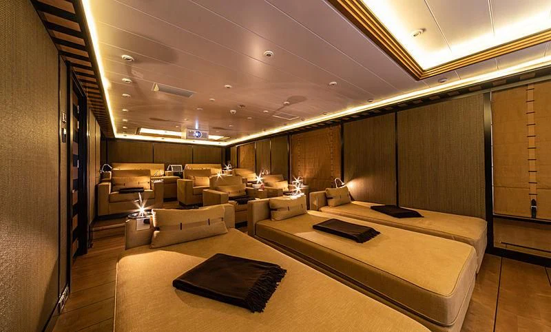 a room with a bed and a couch aboard AHS Yacht for Sale
