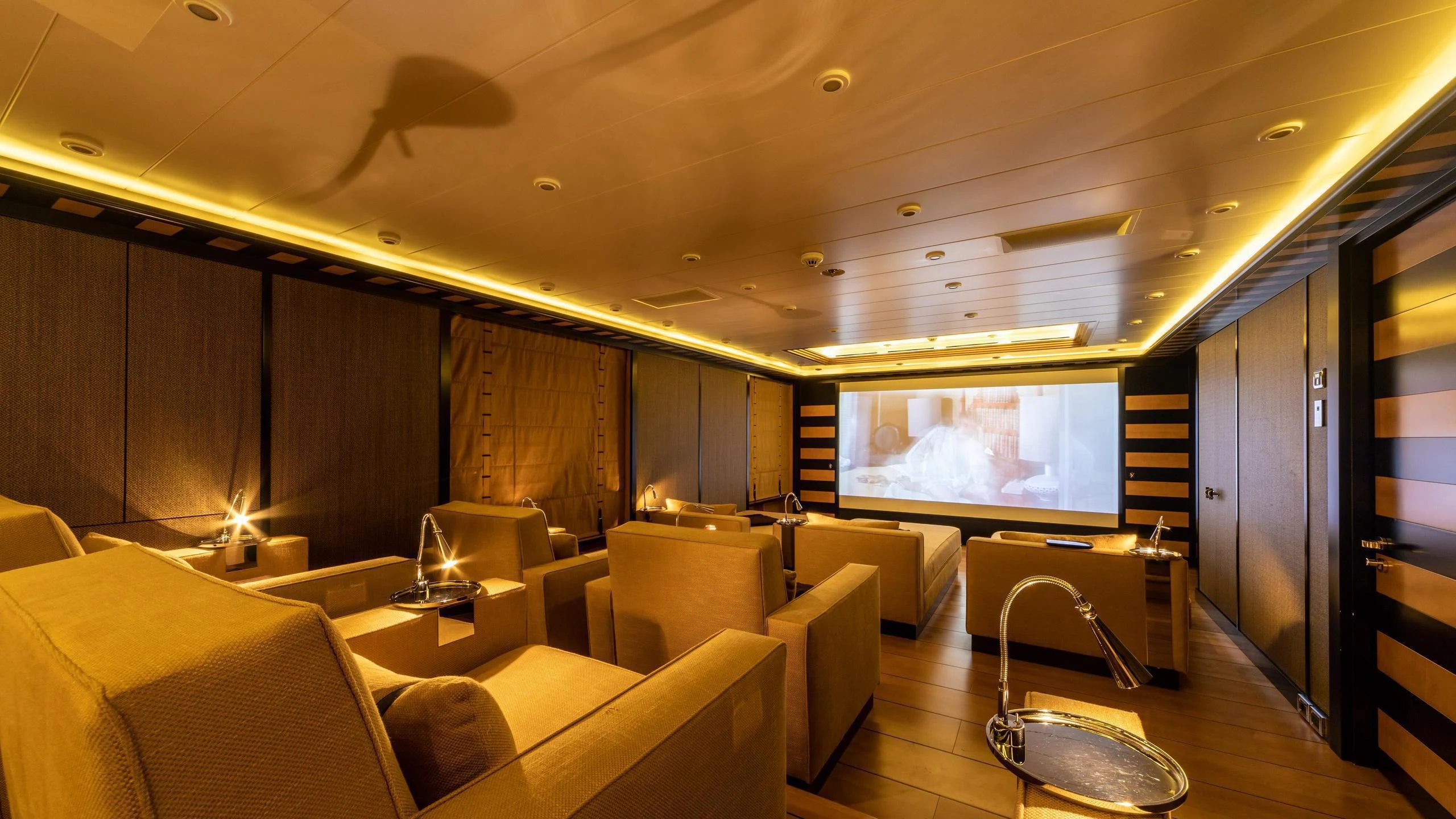 a room with a large screen aboard AHS Yacht for Sale