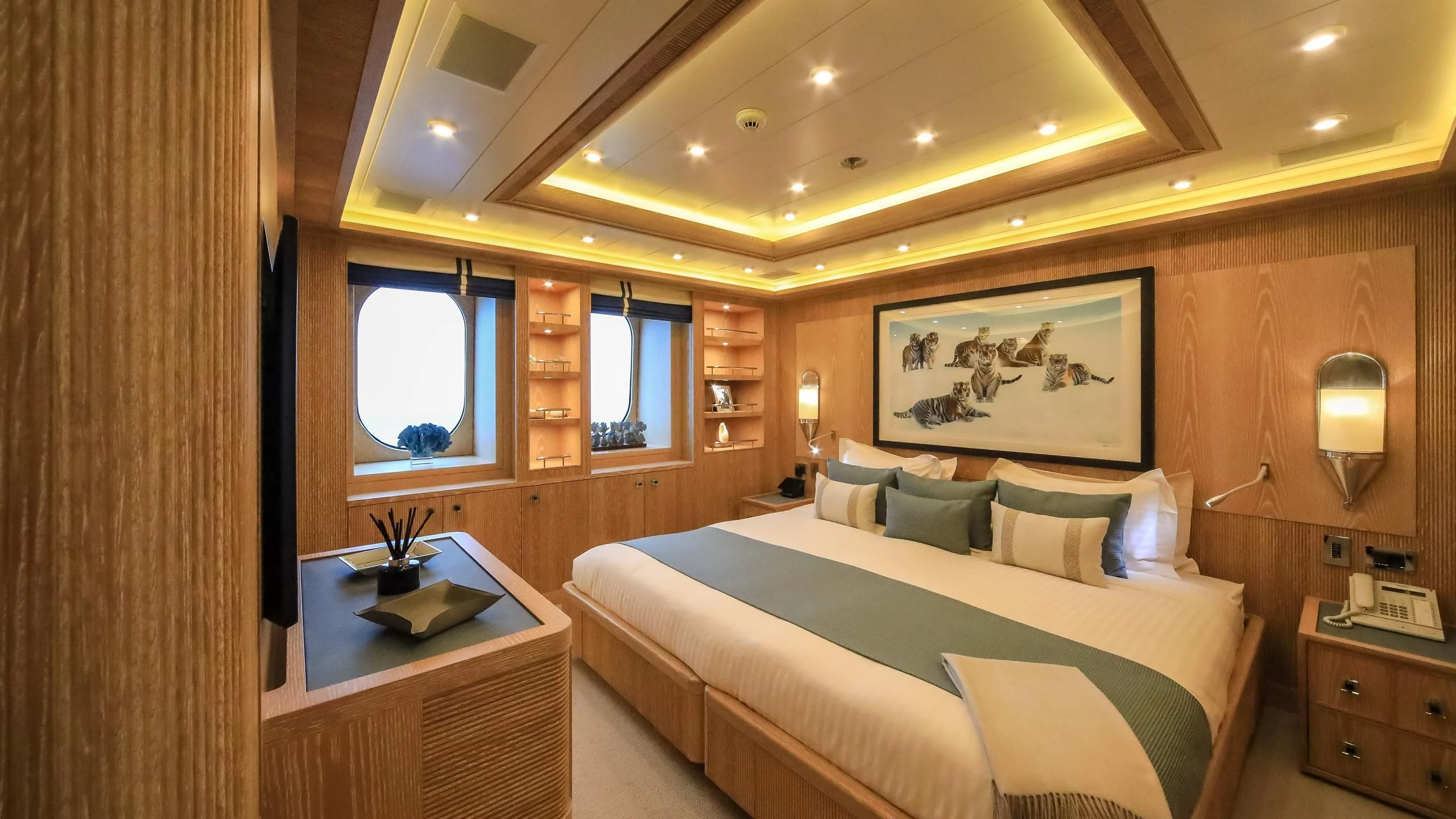 a room with a bed and a desk aboard AHS Yacht for Sale