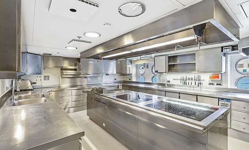 a kitchen with stainless steel appliances aboard AHS Yacht for Sale