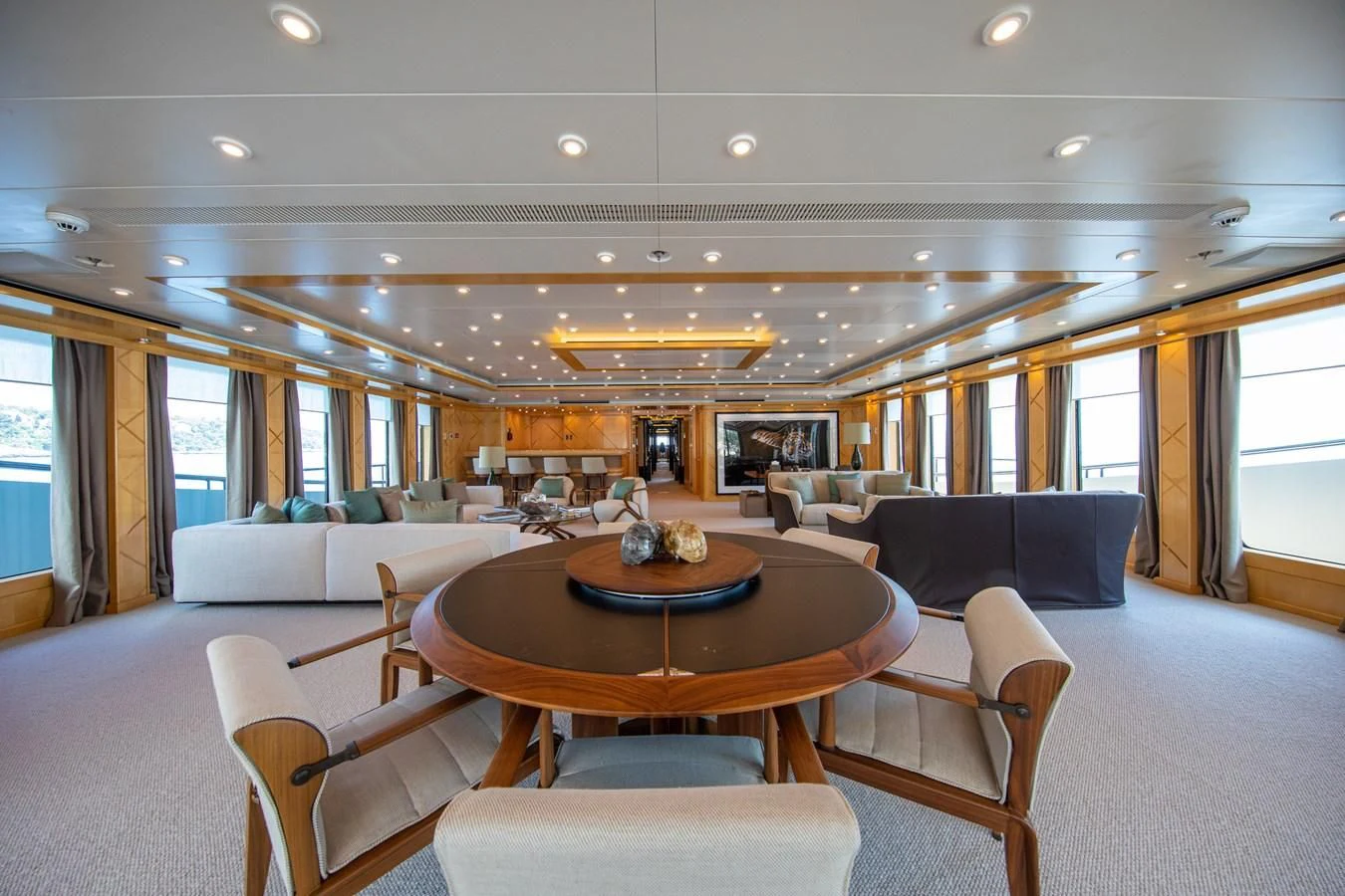a living room with a table and chairs aboard AHS Yacht for Sale