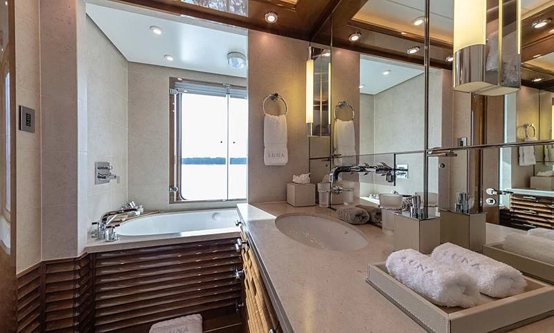 a bathroom with a large mirror aboard AHS Yacht for Sale