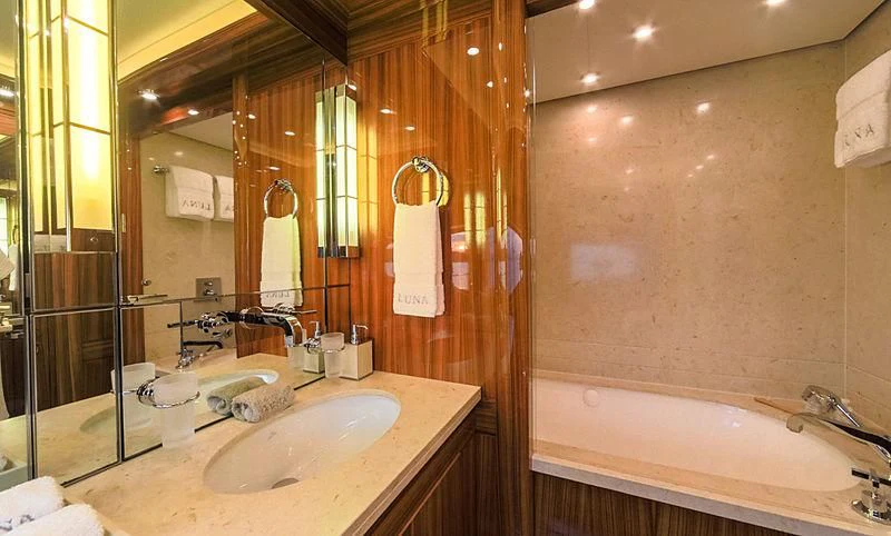 a bathroom with a sink and tub aboard AHS Yacht for Sale