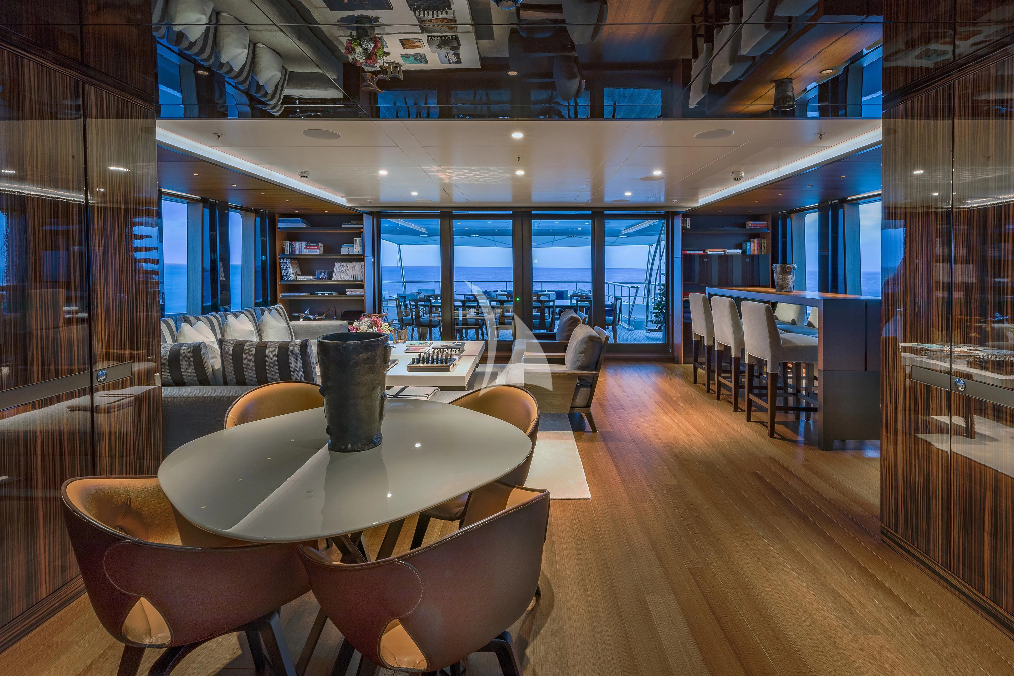 a room with a table and chairs aboard HALO Yacht for Charter