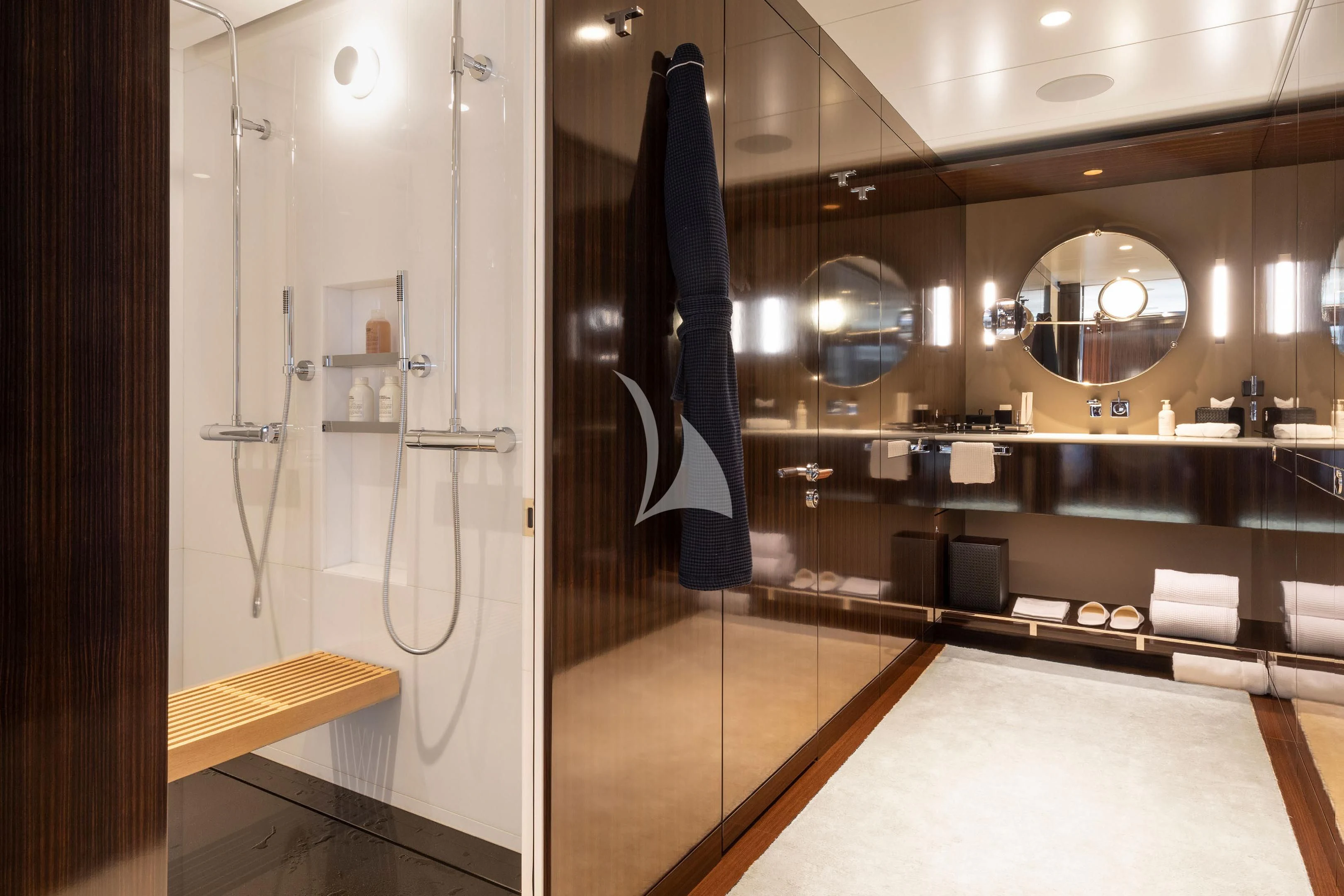 a large bathroom with a large mirror aboard HALO Yacht for Charter