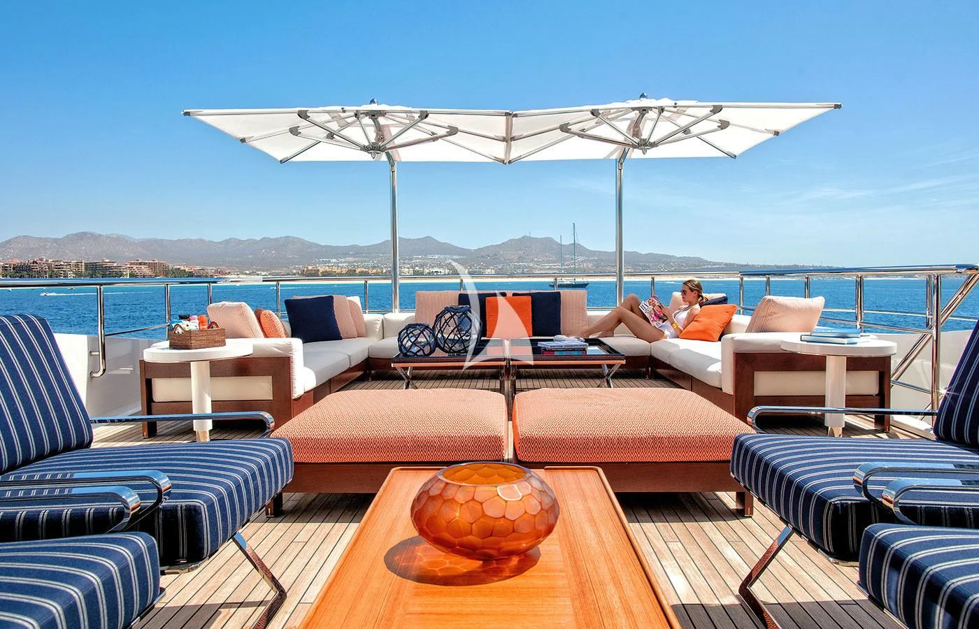 a large patio with a large umbrella aboard HALO Yacht for Charter