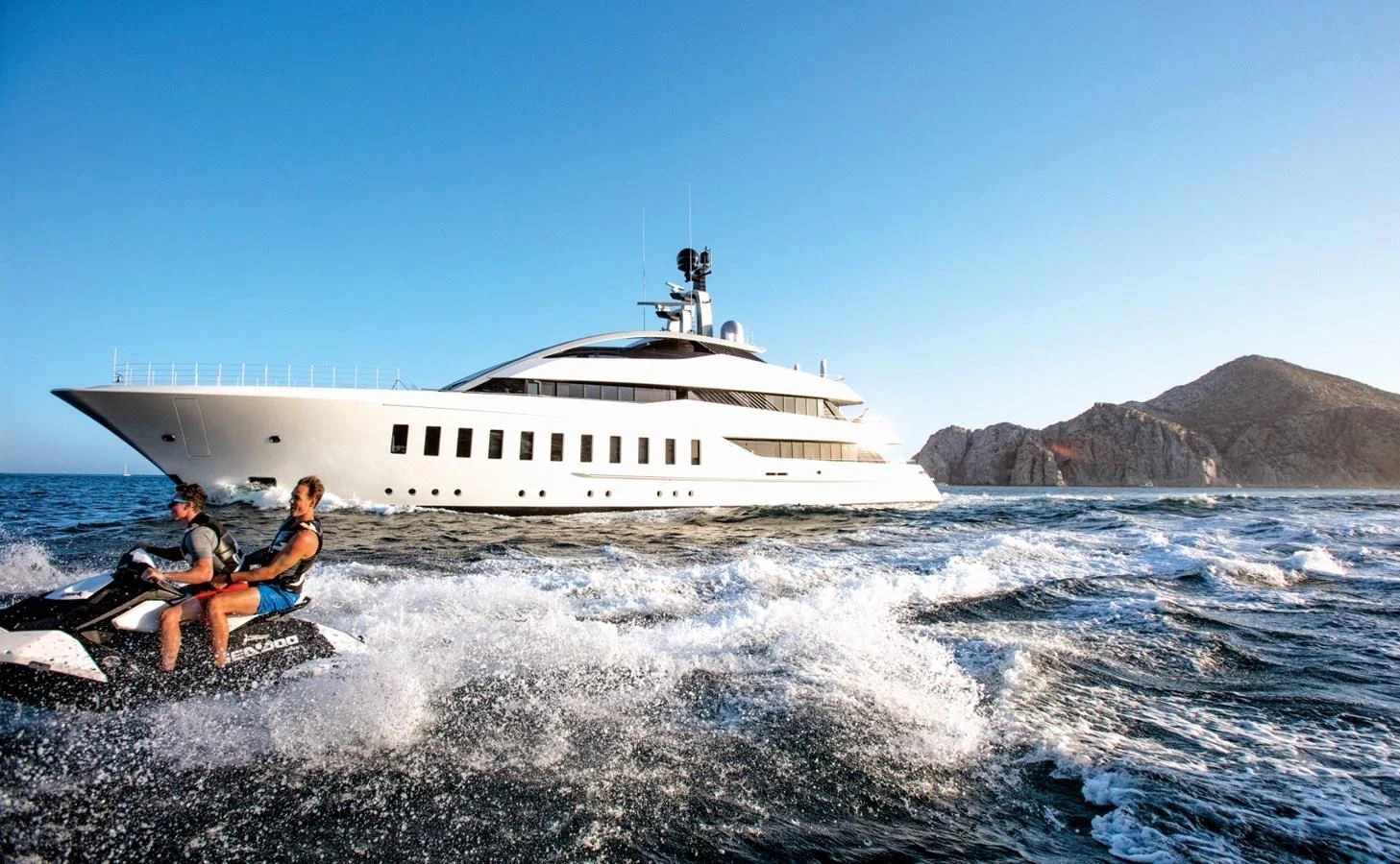 a couple people on a boat in the water aboard HALO Yacht for Charter