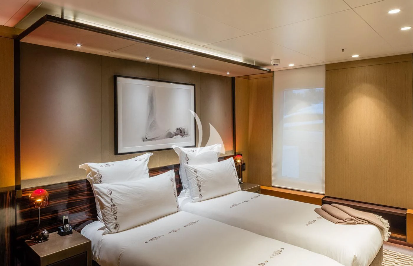 a hotel room with a large television aboard HALO Yacht for Charter