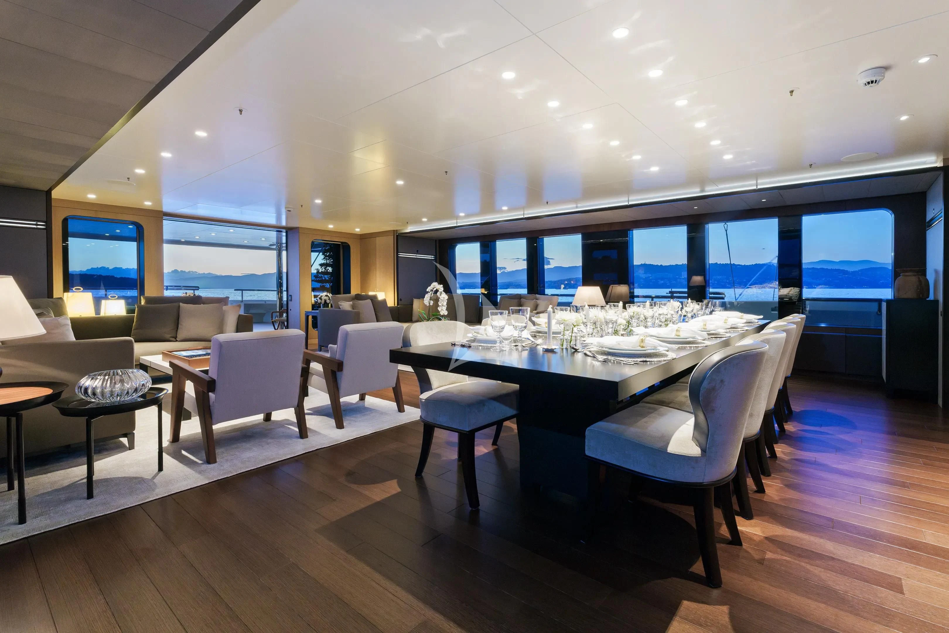 a room with a table and chairs aboard HALO Yacht for Charter