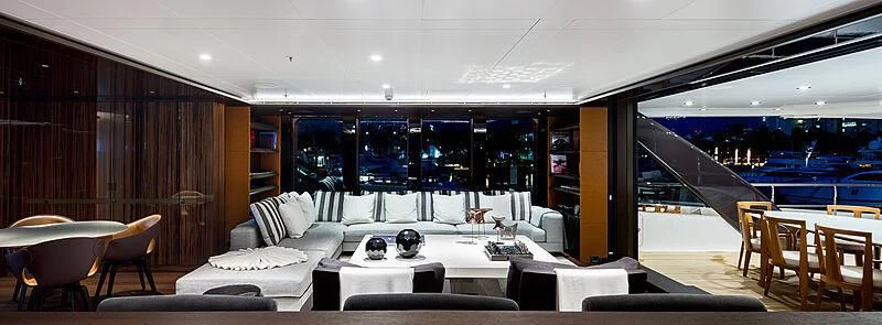 a room with a couch and a table and chairs aboard HALO Yacht for Charter