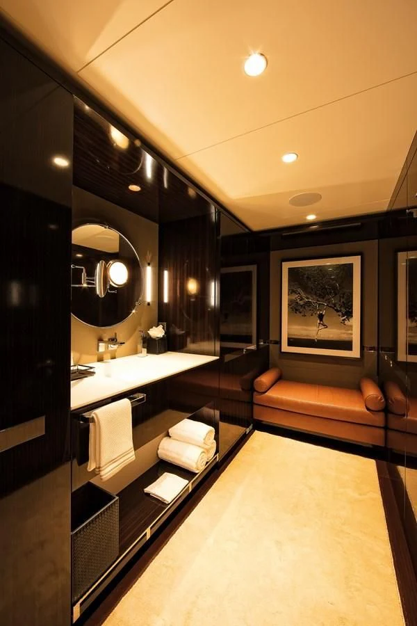 a bathroom with a large mirror aboard HALO Yacht for Charter
