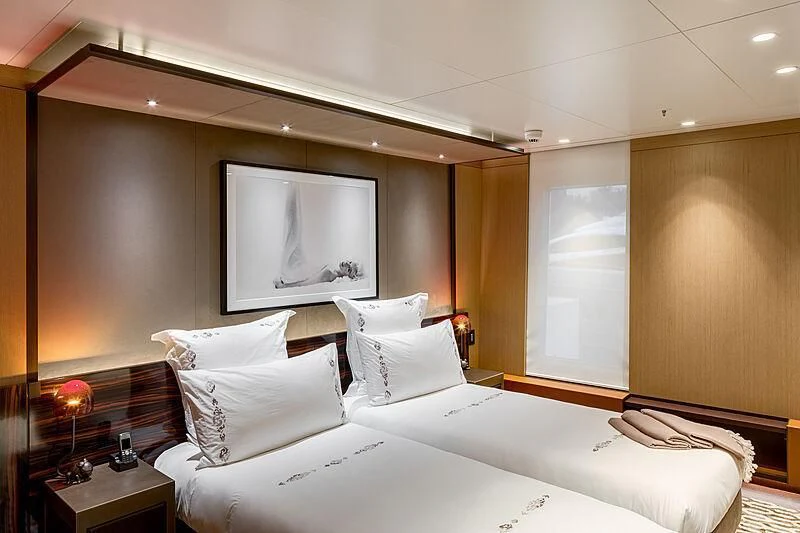 a hotel room with a large television aboard HALO Yacht for Charter