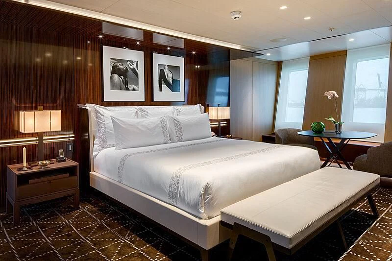 a large bed in a hotel room aboard HALO Yacht for Charter