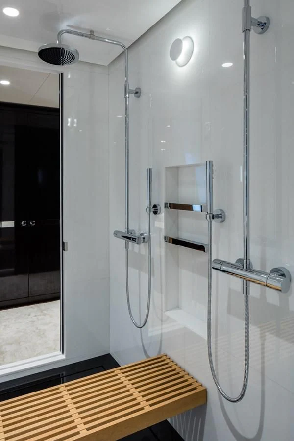 a shower unit in a bathroom aboard HALO Yacht for Charter
