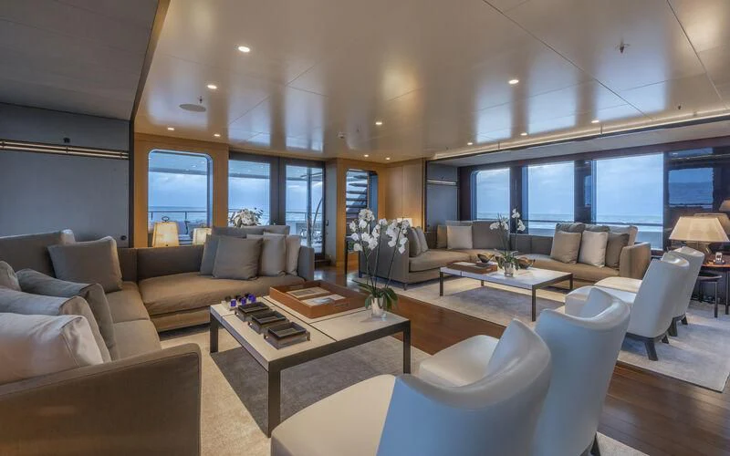 a living room with a large window aboard HALO Yacht for Charter