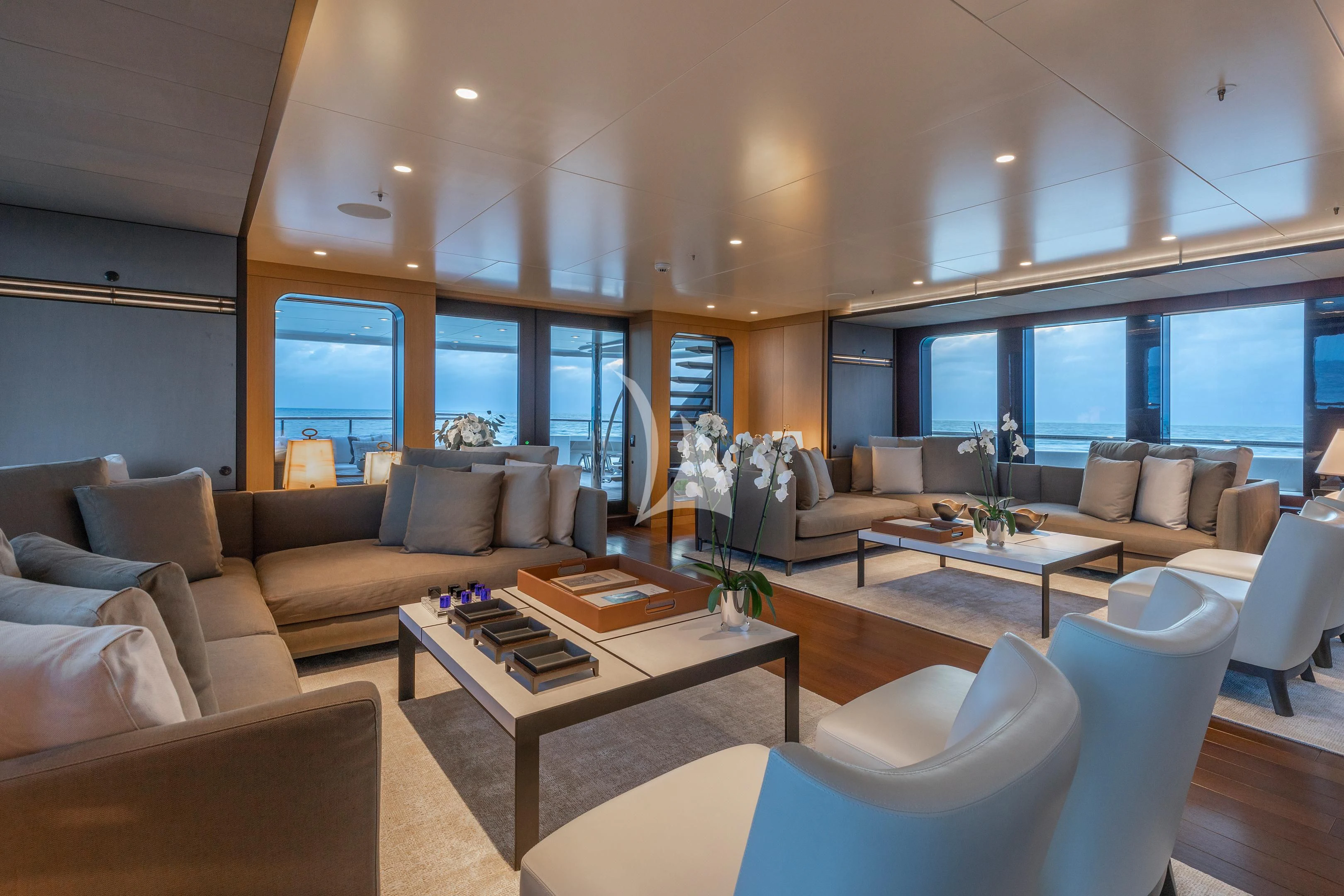a living room with a large window aboard HALO Yacht for Charter