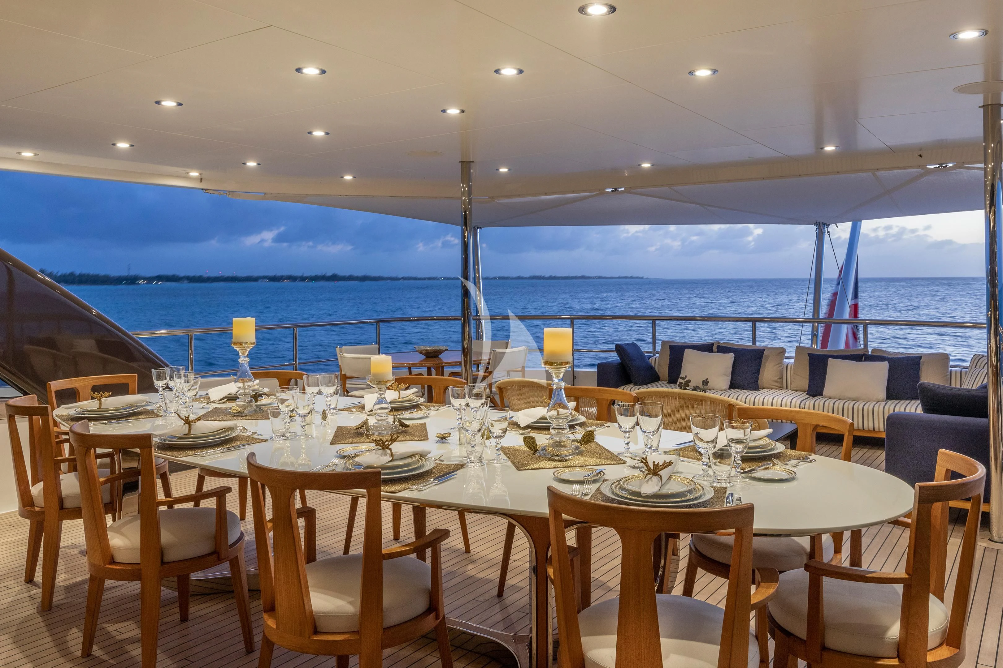 a table set for a dinner aboard HALO Yacht for Charter