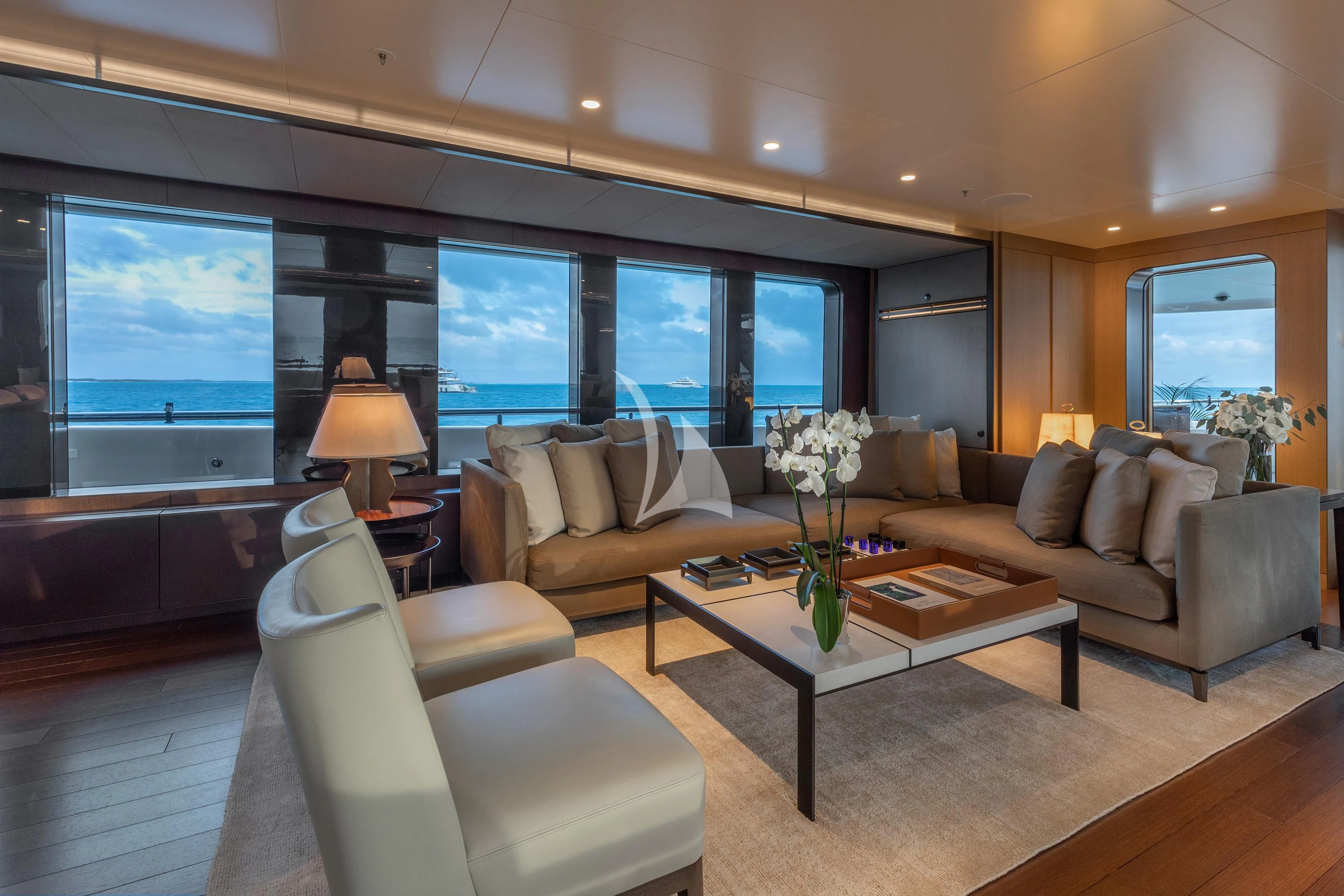 a living room with a large window aboard HALO Yacht for Charter