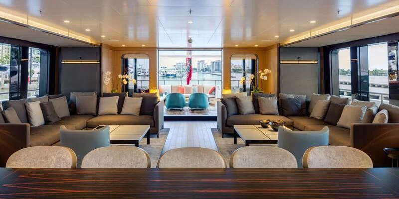 a living room with a large window aboard HALO Yacht for Charter