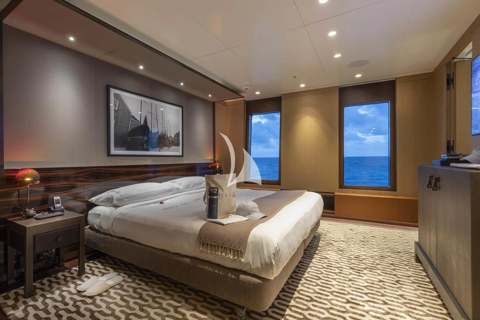 a large bedroom with a large bed aboard HALO Yacht for Charter