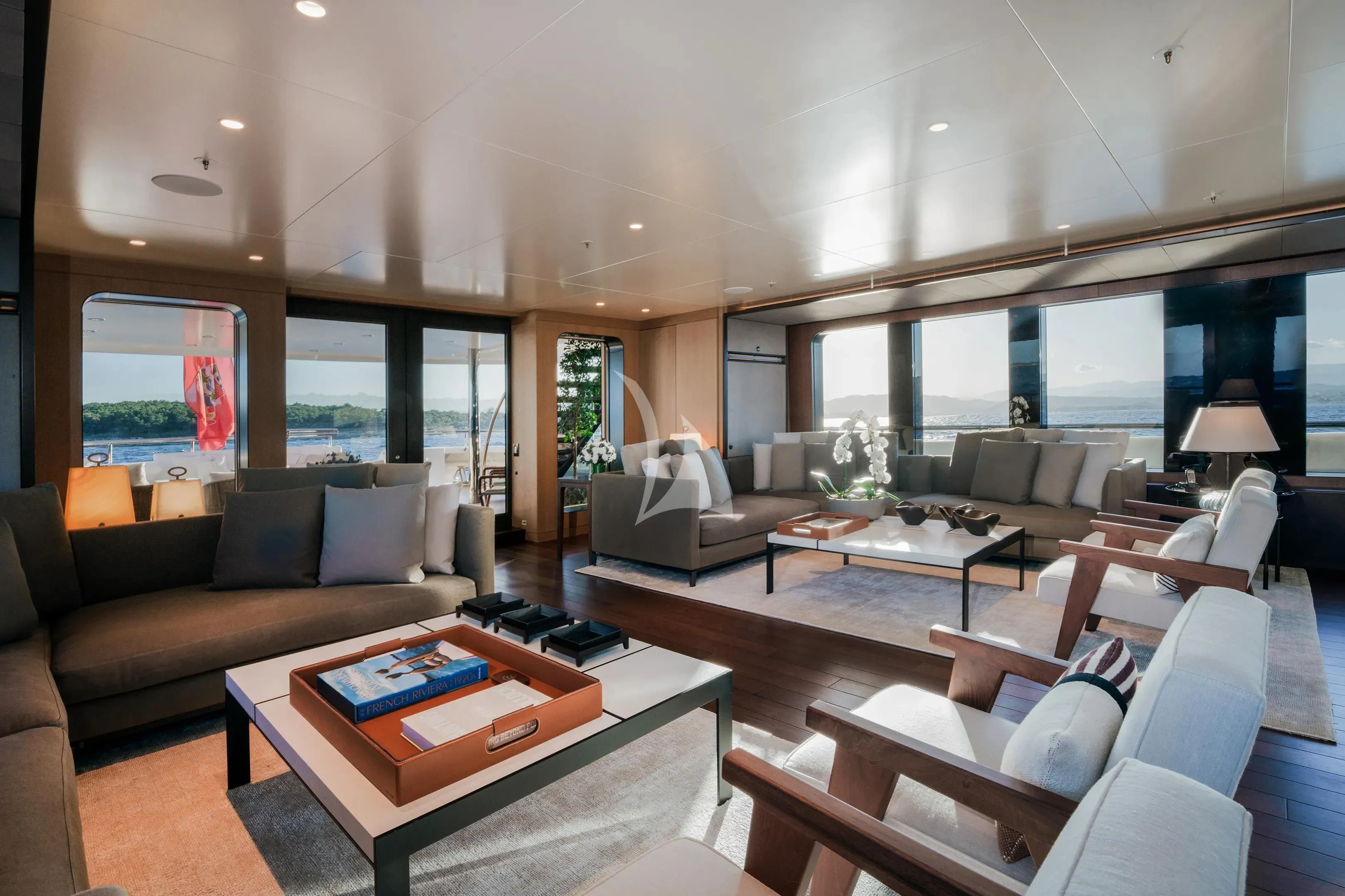a living room with a large window aboard HALO Yacht for Charter