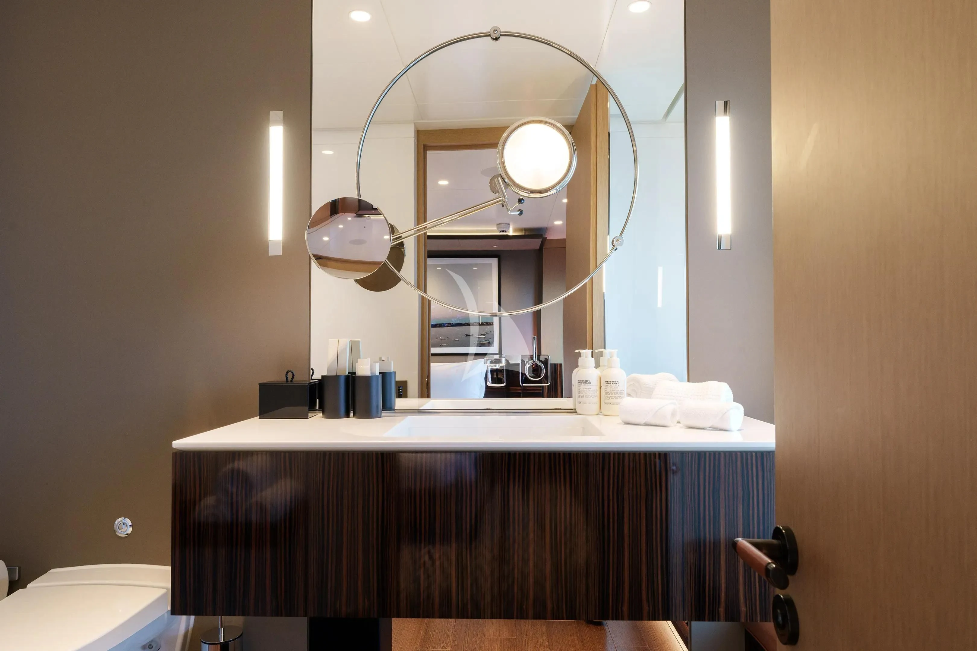 a bathroom with a large mirror aboard HALO Yacht for Charter