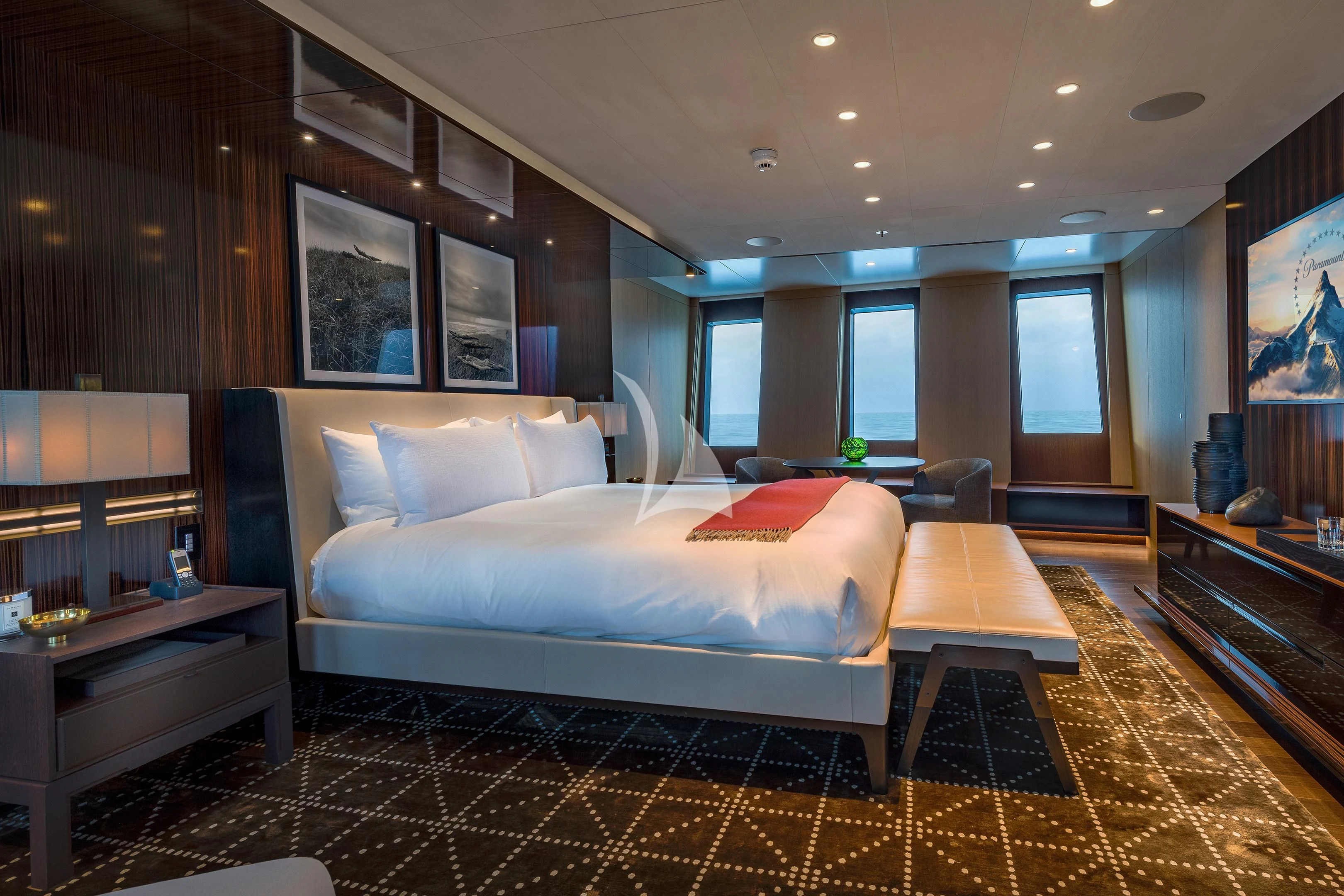 a large bedroom with a large bed aboard HALO Yacht for Charter
